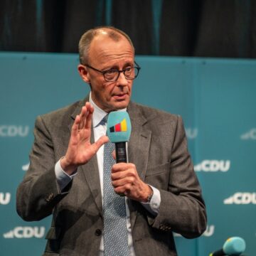 German Chancellor Friedrich Merz On a Microphone In Flensburg, Germany