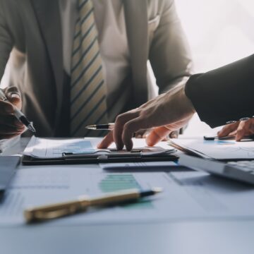 Business Team Meeting Consulting Over Paperwork