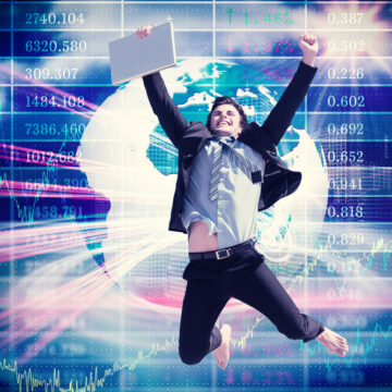 Cheering Businessman Jumping For Joy Against A Background Of Upward Graphs And Ticker Symbols Cheering Businessman Jumping For Joy Against A Background Of Upward Graphs And Ticker Symbols