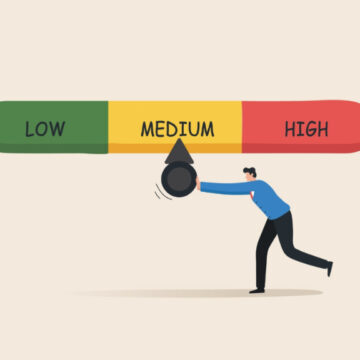 An Illustration Of A Risk Level Indicator, Showing A Person Adjusting A Dial To Indicate A Level Between "Low," "Medium," And "High"