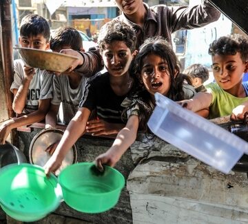 Starving Palestinian Children Prepare To Receive Food Aid