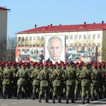 A Parade In Moscow Of The Internal Troops Of The Ministry For Internal Affairs (MVD) Of Russia, With A Large Portrait Of Vladimir Putin In The Background