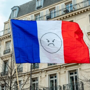 French Flag With Frowny Face In Paris, France