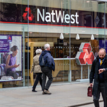 Pedestrians Walk Past A NatWest Bank Branch In Manchester, United Kingdom
