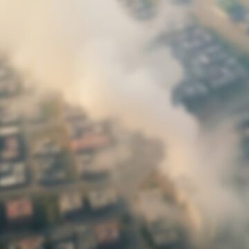 Out-of-Focus Aerial Image Of Bombing Site In Populated Area