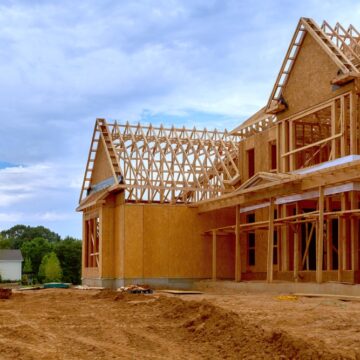 The Wooden Frame Of A Newly Constructed House With Unfinished Interior
