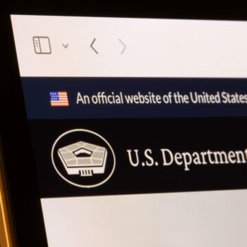 A Website Banner Showing "An Official Website Of The United States Government" And Prominently Featuring The "U.S. Department of War" With A Pentagon-Shaped Logo