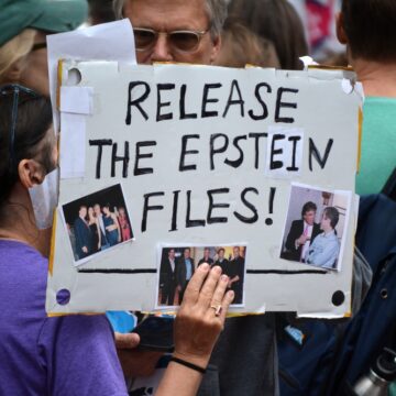 Protesters In New York Holding "Release Epstein Files" Signs