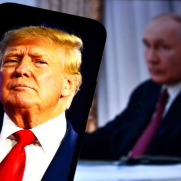 Image Of Donald Trump On A Smartphone Screen With An Image Of Vladimir Putin In The Background