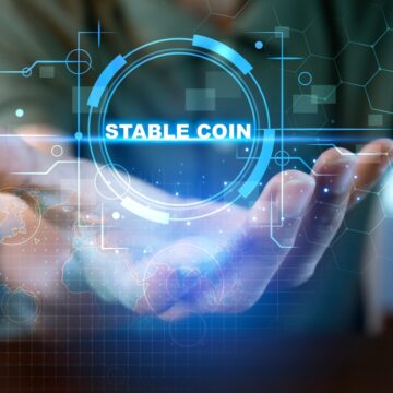 Concept Of Using Stablecoins With A Hand "Holding" A Digital Stablecoin