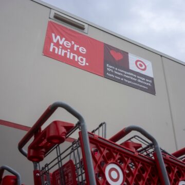 A "We're Hiring" Banner Hangs On The Side Of A Target Store In Tigard, OR