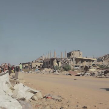A Photo Of A Young Boy And His Bike In Gaza City, Gaza Strip, Along With Displaced Civilians And Destroyed Buildings