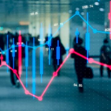 Composite Image Overlays Stock Market Charts–Candlestick Blue And Red Bars And Line Graphs–With A Photo Of People Walking In A Busy Public Space