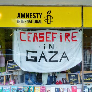 A Shop Window, In Lund, Sweden, With An Amnesty International Sign And A Banner Demanding A Ceasefire In Gaza