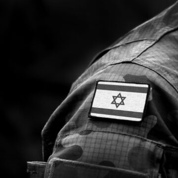 The Flag Of Israel On The Sleeve Patch Of A Military Uniform, Indicating A Soldier In The Israel Defense Forces (IDF)