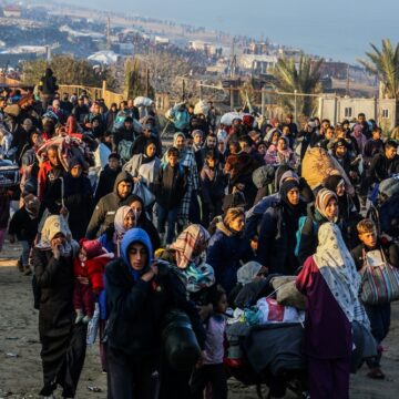 Thousands of Palestinian Refugees, Carrying Their Belongings And Walking Along A Coastal Road, Return To Their Home In Northern Gaza After Being Displaced To The South During The Israel-Hamas War