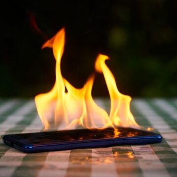 Image Of A Mobile Phone Exploding Into Flames, Typically Caused By The Thermal Runaway Of Its Lithium-ion Battery Image Of A Mobile Phone Exploding Into Flames, Typically Caused By The Thermal Runaway Of Its Lithium-ion Battery