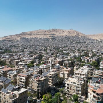 Aerial View Of Damascus, Syria, With Mount Qasioun Visible In The Background