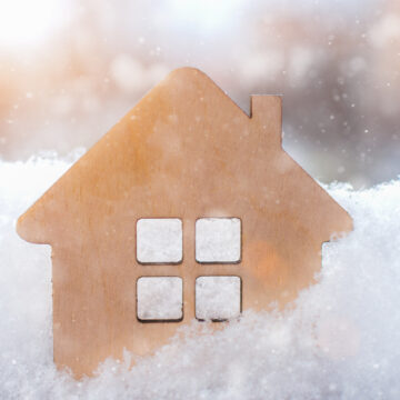 A Stock Photo Of A Small Wooden Toy House In The Winter Snow