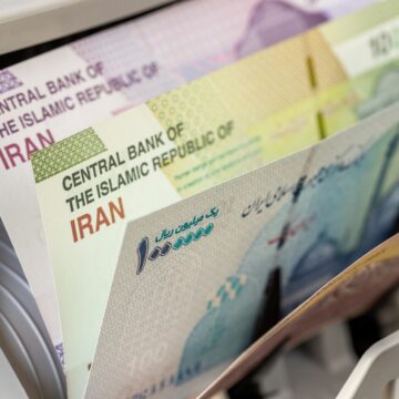 The photo shows Iranian rial banknotes – the national currency of Iran – being counted by a machine. The photo shows Iranian rial banknotes – the national currency of Iran – being counted by a machine.
