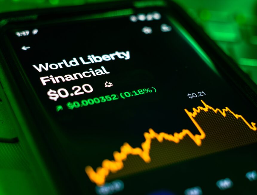An image of a mobile phone displaying the name, stock price, and upward trending stock chart for World Liberty Financial, a Trump family cryptocurrency business. An image of a mobile phone displaying the name, stock price, and upward trending stock chart for World Liberty Financial, a Trump family cryptocurrency business.