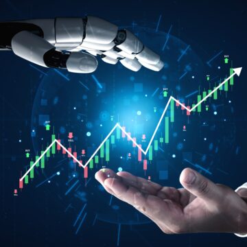 Concept image of artificial intelligence (AI) in stock market trading, showing a robotic hand interacting with a rising stock chart and human hand.