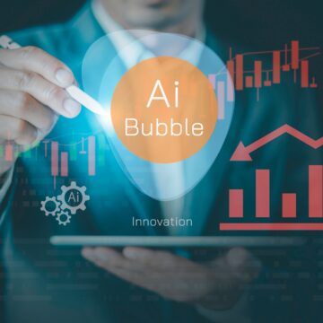 Concept graphic image illustrates "AI bubble" hovering above a laptop and directed by a businessman with a stylus alongside graphs.