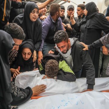 Palestinians are seen bidding farewell to relatives who were killed in an Israeli air strike on April 21, 2024, at Al-Najjar Hospital in Rafah, in the southern Gaza Strip.