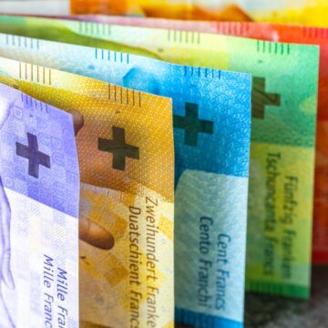 A Colorful Fan Of Swiss Franc Banknotes–The Official Currency Of Switzerland And Liechtenstein–Seen In Denominations Of 50, 100, 200, And 1000 Franc Notes.