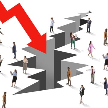 Collage representing a concept of economic crisis with a large red downward arrow pointing toward a large crack in the ground surrounded by people dressed in business attire are scattered around the crack. Collage representing a concept of economic crisis with a large red downward arrow pointing toward a large crack in the ground surrounded by people dressed in business attire are scattered around the crack.