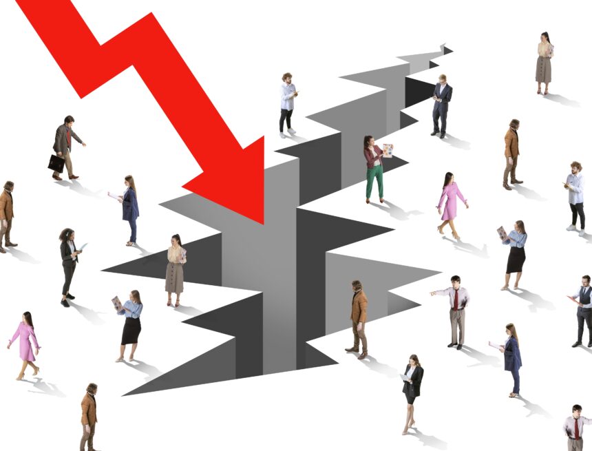 Collage representing a concept of economic crisis with a large red downward arrow pointing toward a large crack in the ground surrounded by people dressed in business attire are scattered around the crack. Collage representing a concept of economic crisis with a large red downward arrow pointing toward a large crack in the ground surrounded by people dressed in business attire are scattered around the crack.