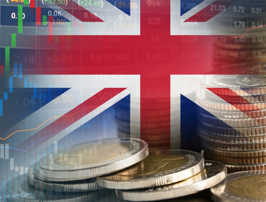 Concept graphic showing the Union Jack (the national flag of the UK) with several financial elements such as stacked coins–the British Pound Sterling – and graphs and charts.