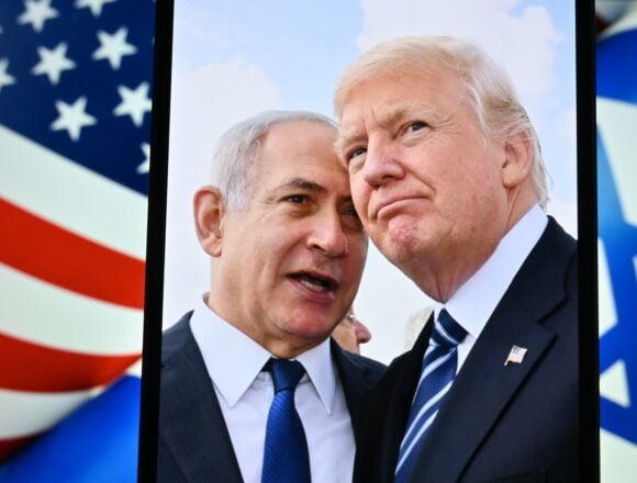 Photo of Israel Prime Minister Netanyahu and U.S. President Donald Trump standing close together at the Israeli parliament (Knesset) in Jerusalem.