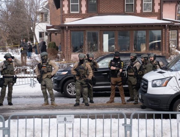 Federal law enforcement officers in Minneapolis, Minnesota, following the fatal shooting of 37-year-old Renee Nicole Good by an Immigration and Customs Enforcement (ICE) agent on January 7, 2026.