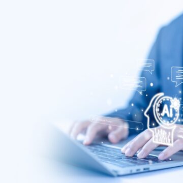 Concept graphic of AI integration showing a man interacting with AI technology via a laptop. Concept graphic of AI integration showing a man interacting with AI technology via a laptop.