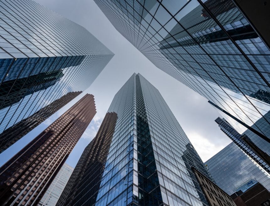 A low-angle view of modern glass and steel skyscrapers in the Financial District in downtown Toronto, Canada.