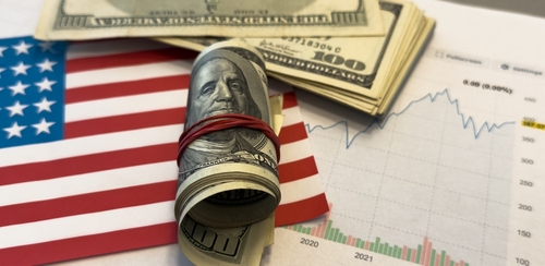 Financial trends concept image featuring U.S. currency placed on top of a financial chart with an upward trajectory.