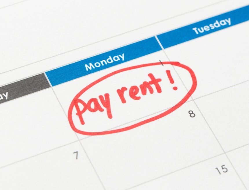 Image Of A Calendar With The Message "Pay Rent!" Circled In Red Ink On The 1st Of The Month. Image Of A Calendar With The Message "Pay Rent!" Circled In Red Ink On The 1st Of The Month.