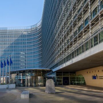 Photo Of The Berlaymont Building In Brussels, Belgium, Which Is The Headquarters Of The European Commission Whose Main Role Includes Proposing New Laws And Policies And Monitoring Their Implementation.
