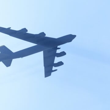 An Overhead View Of A Boeing B-52 Stratofortress Flying Overhead. This Long-range, Heavy Bomber Has Been A Cornerstone Of The U.S. Air Force's Strategic Bomber Force For Over 60 years.