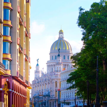 A Photo Of The National Capitol of Cuba (El Capitolio) In Havana, As Seen From The Adjacent Paseo del Prado Boulevard.