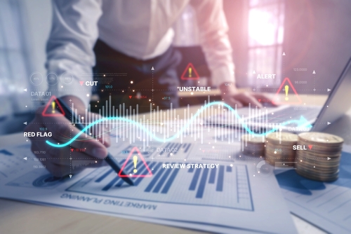 Conceptual image of financial market data analysis, showing a business man, graphs, and data charts.