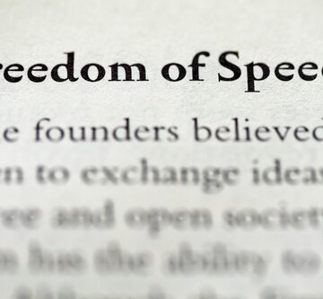 The image displays the title "Freedom of Speech" followed by a short text discussing its foundational importance to a free and open society.