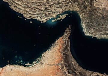 A satellite view of the Strait of Hormuz, a vital waterway connecting the Persian Gulf to the Gulf of Oman and the Indian Ocean.