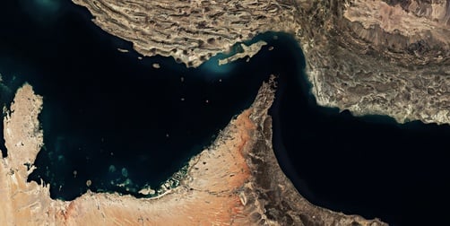 A satellite view of the Strait of Hormuz, a vital waterway connecting the Persian Gulf to the Gulf of Oman and the Indian Ocean.
