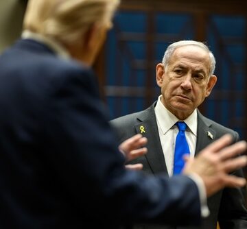 Israeli Prime Minister Benjamin Netanyahu (right) in conversation with U.S. President Donald Trump (left, back to camera).