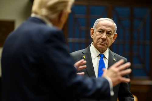 Israeli Prime Minister Benjamin Netanyahu (right) in conversation with U.S. President Donald Trump (left, back to camera).
