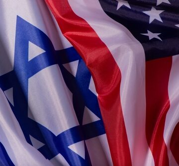 A close-up, draped combination of the official flags of the United States and Israel.