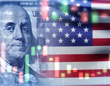 A U.S. economy concept showing a financial stock market chart, the American flag, and a portrait of Benjamin Franklin from the hundred-dollar bill.