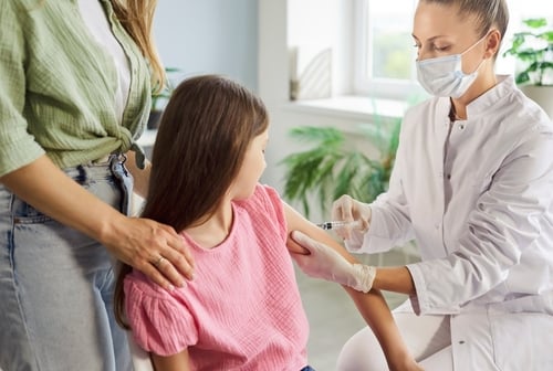 Child,Receives,Vaccination,Injection,From,Doctor.,A,Nurse,Uses,A MAJORITY OF AMERICANS BELIEVE VACCINES ARE SAFE, CHILDREN SHOULD TAKE THEM TO ATTEND SCHOOL